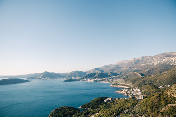 Fototapeta na wymiar Coast of the Bay of Kotor surrounded by a mountain range. Montenegro