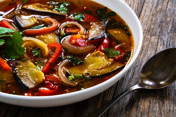 Vegetable soup on wooden table

