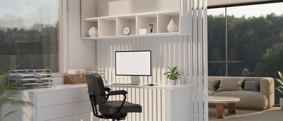 Modern white office or home office room with a computer mockup on a desk against the partition wall.