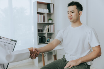 Obraz premium A doctor is counseling a young male patient about prostate cancer and venereal disease, including male sexual dysfunction. Prostate cancer concept