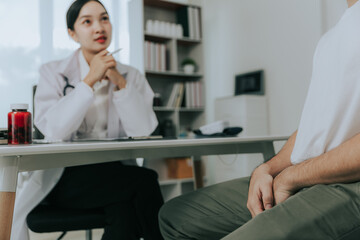 A doctor is counseling a young male patient about prostate cancer and venereal disease, including...
