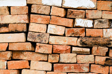 Textured background of old stacked bricks