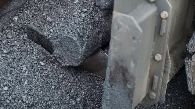Process of asphalting road construction infrastructure by spreading, compressing, compacting, leveling and smoothing the asphalt road surface using a hopper asphalt paver finisher