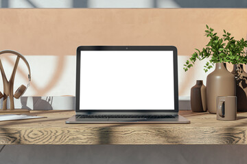 Close up of modern wooden designer desk top with empty white mock up place on laptop screen, coffee cup, supplies and other items. 3D Rendering.