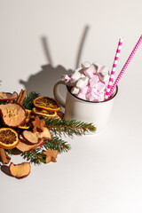 Christmas background with a mug of hot chocolate and marshmello on top