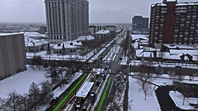 TRAX light rail system in a snowy downtown Salt Lake City, aerial view