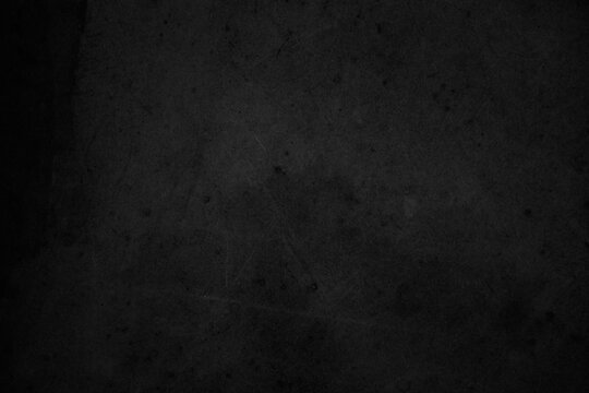 Black dark concrete wall background. Pattern board cement texture grunge dirty scratched for show anthracite promote product urban floor and abstract paper design element decor. Blackboard blank.