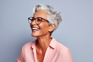 Happily smiling Matured woman side close up portrait view with wrinkles and wearing specs isolated on minimalist copy space background. beautiful smiling woman with good health and skin care concept - obrazy, fototapety, plakaty