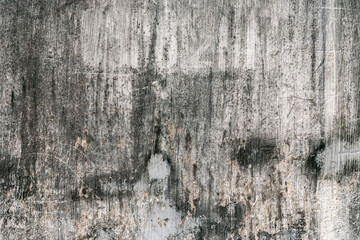 Grunge style urban weathered shabby  peeled painted concrete unique moody surface of the wall with holes, spots,  scratches and cracks macro background