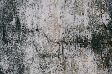 Grunge style urban weathered shabby  peeled painted concrete dark gothic moody surface of the wall with holes, dirty and cracks macro