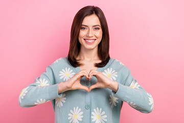 Photo of adorable sweet woman dressed teal outfit showing arms heart isolated pink color background