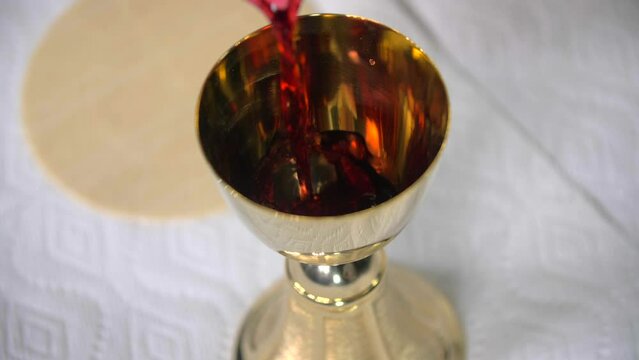 Pouring Wine Into Goblet Eucharist Cavanah Bread Communion Pope Peter Christian Catholic Episcopal Lutheran Southern Baptist Church Denomination Body Of Christ Jesus Crucifixion Savior Righteous Mass