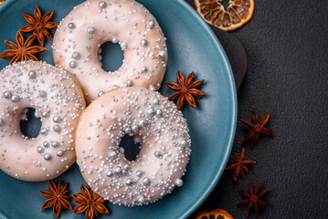 Delicious fresh donut of white or beige color with silver beads and cream
