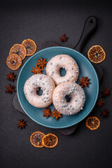 Delicious fresh donut of white or beige color with silver beads and cream