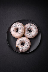 Delicious fresh donut of white or beige color with silver beads and cream