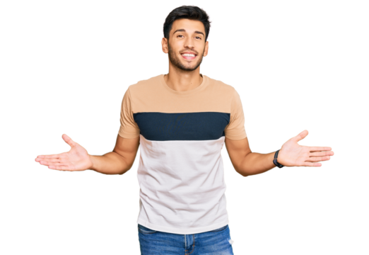 Young handsome man wearing casual clothes smiling showing both hands open palms, presenting and advertising comparison and balance