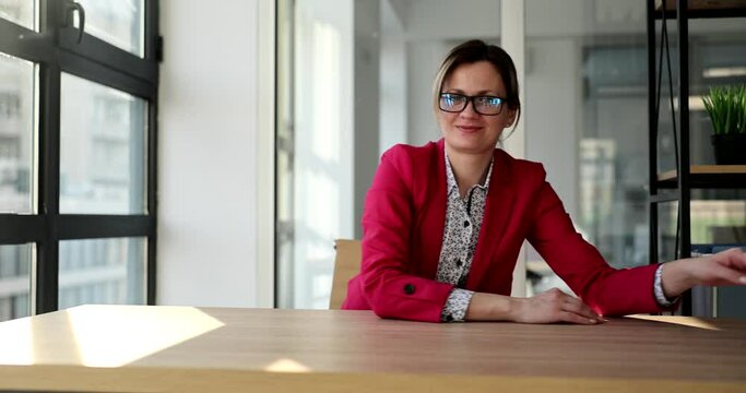A beautiful business woman in the office throws crumpled paper, a close-up. Start the concept over again
