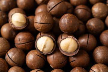 Close up of peeled macadamia nuts background.