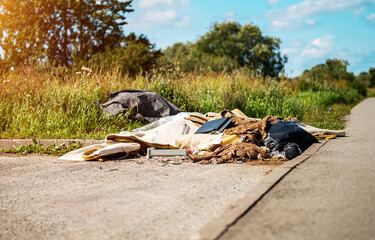 Lots of trash on the side of the road.