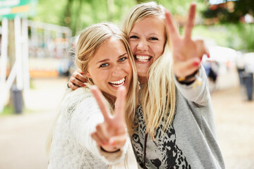 Portrait, outdoor festival and happy friends peace sign, celebrate or happiness for fun bonding,...