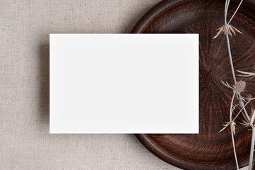 Minimalist elegant business brand template, blank paper card mockup on brown ceramic plate, neutral...