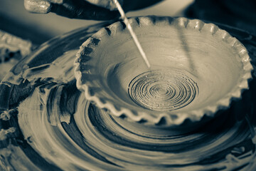 Pottery. The oldest trade from Daco-Roman times. Hands dirty with clay. Ceramics. Modeling in clay. Color and black-and-white detail photos.