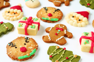 Assortment of Delectable Christmas Cookies Scattered on White Background