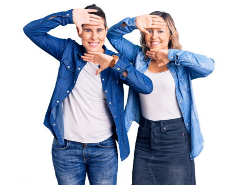 Couple of women wearing casual clothes smiling cheerful playing peek a boo with hands showing face. surprised and exited