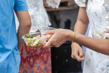 Women hands holding food, Thai street food