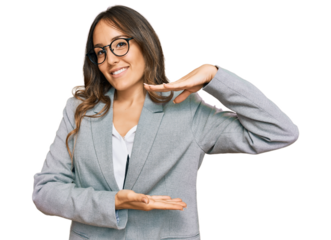 Young brunette woman wearing business clothes gesturing with hands showing big and large size sign, measure symbol. smiling looking at the camera. measuring concept.