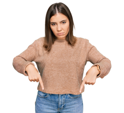 Young beautiful woman wearing casual clothes pointing down looking sad and upset, indicating direction with fingers, unhappy and depressed. - Powered by Adobe