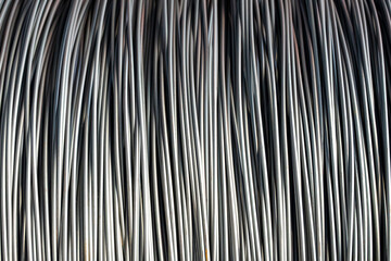 Pile of iron, metal or steel wire rod or coil background for Construction industry. steel wire...