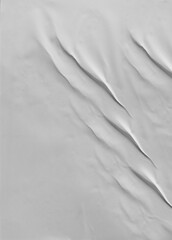 Obraz premium Background image of a vertical thin gray paper with a crumpled surface