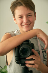 a boy with camera in his hands