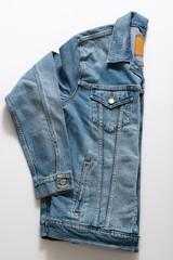 Side View of Blue Truckers Denim Jacket Isolated on White Background