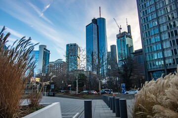 City photo, modern buildings in the financial center. High-rise buildings and street canyons in a city. The city center in the morning in Frankfurt am Main, Germany