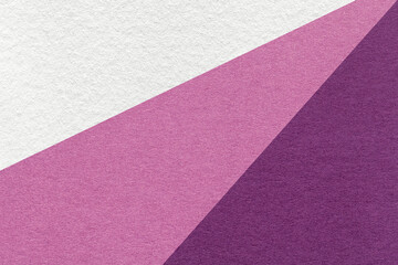 Texture of old craft white, lilac and violet color paper background, macro. Vintage abstract purple cardboard