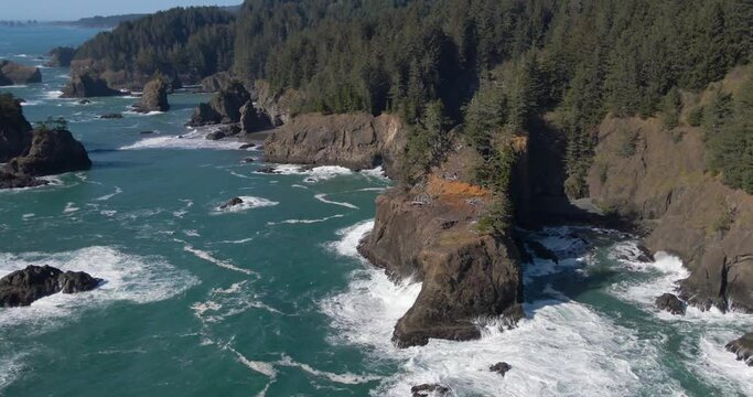 rocky cliffs and coastline of waves crashing at samuel boardman brookings oregon 4k drone footage