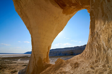  Natural arch on the Tuzbair salt marsh. Natural arch at Tuzbair is a natural formation carved by...