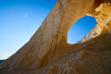 Natural arch on the Tuzbair salt marsh. Natural arch at Tuzbair is a natural formation carved by...