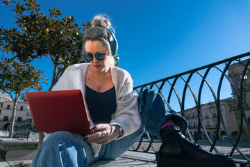 Woman's Laptop Work in Urban Setting