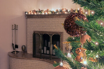 Fireplace in New Year's decoration in the interior of the house