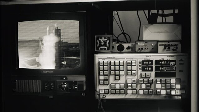 Rocket Launch Old Monitor Control Room Vintage Tech Film Texture. Vintage technology control room monitoring a rocket launch, monochrome. Old film texture