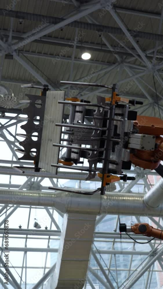 Poster demonstration of an automated robotic technological manipulator loader at the factory