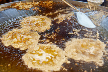 Fried Oyster with Egg in frying pan at street market