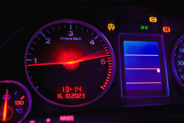Car's dashboard.Modern car dashboard panel at night time.Closeup,selective focus.