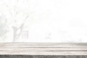 Perspective light empty wooden table from above on blurred background can be used mockup to display installation products or design layout.