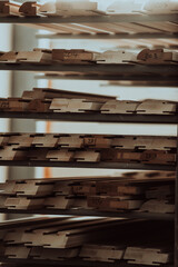 A vast warehouse in the forestry industry, showcasing a plethora of wooden products, including boards and various timber items neatly organized in storage