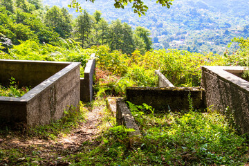 travel to Georgia - old graves with stone fences on Erge cemetery on mountain in Batumi city on...