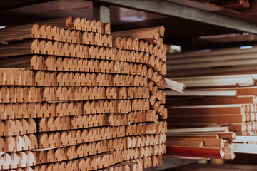 A vast warehouse in the forestry industry, showcasing a plethora of wooden products, including boards and various timber items neatly organized in storage - obrazy, fototapety, plakaty